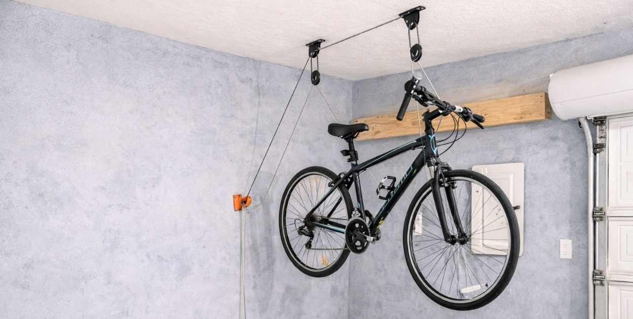 Bicycle hoisted in garage storage system
