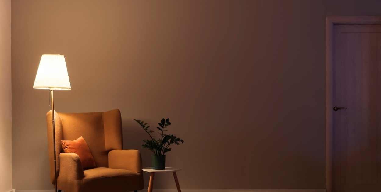 living room layered lighting floor lamp table lamp warm light cozy evening